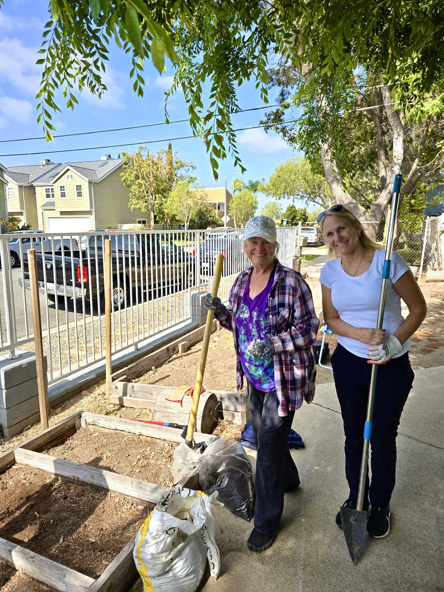 Amelia Painter and Linda Kraemer preparing garden beds at the Wilson Street Learning Center in Costa Mesa, CA. 